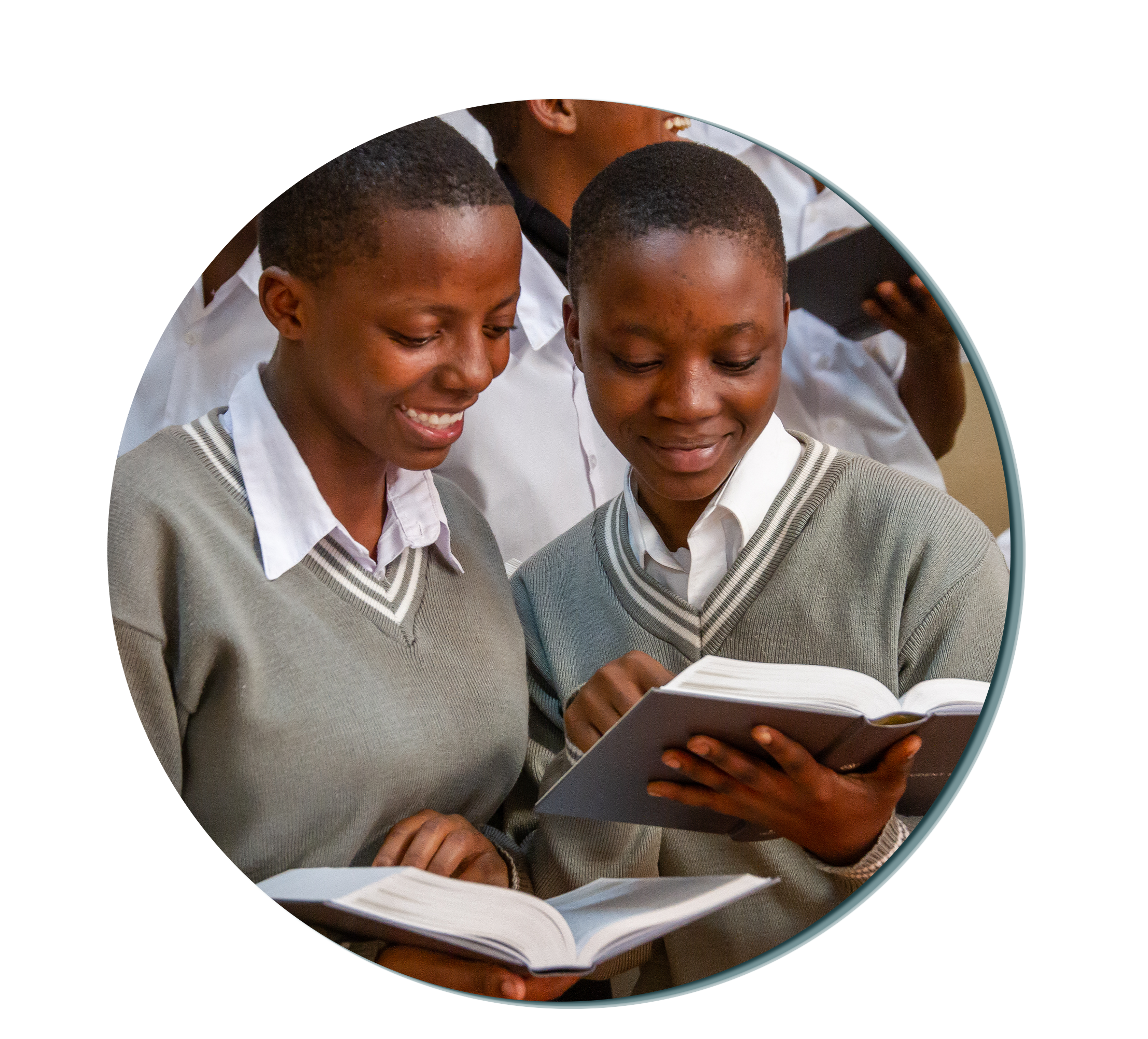Two girls looking over bibles